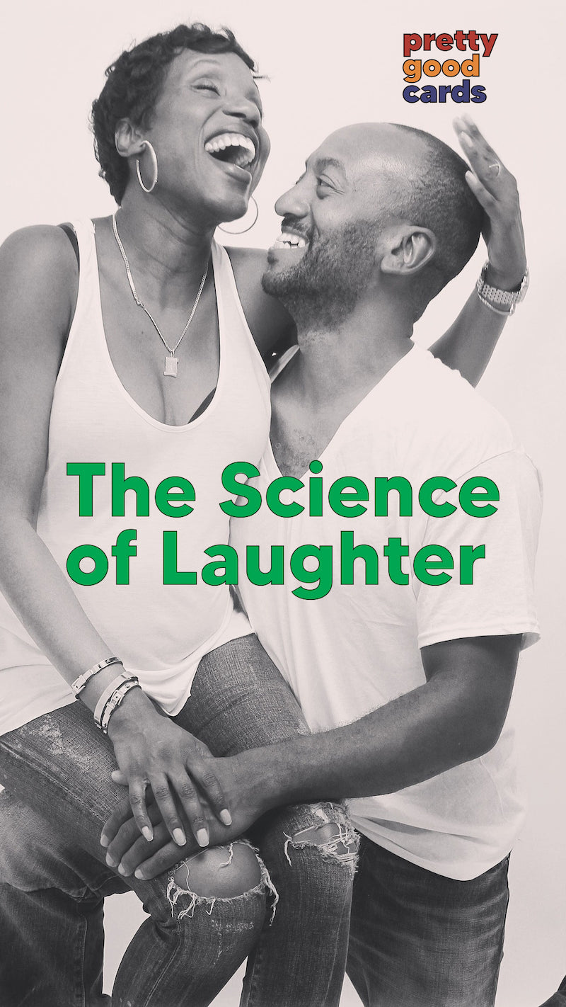 a couple laughs broadly, probably because they just read some funny greeting cards