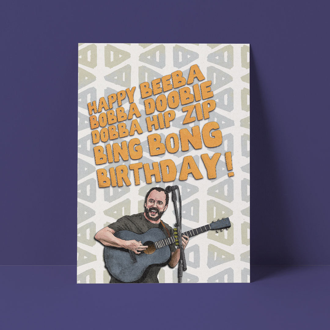 A birthday card featuring Dave Matthews sits against a purple background. It's glorious.