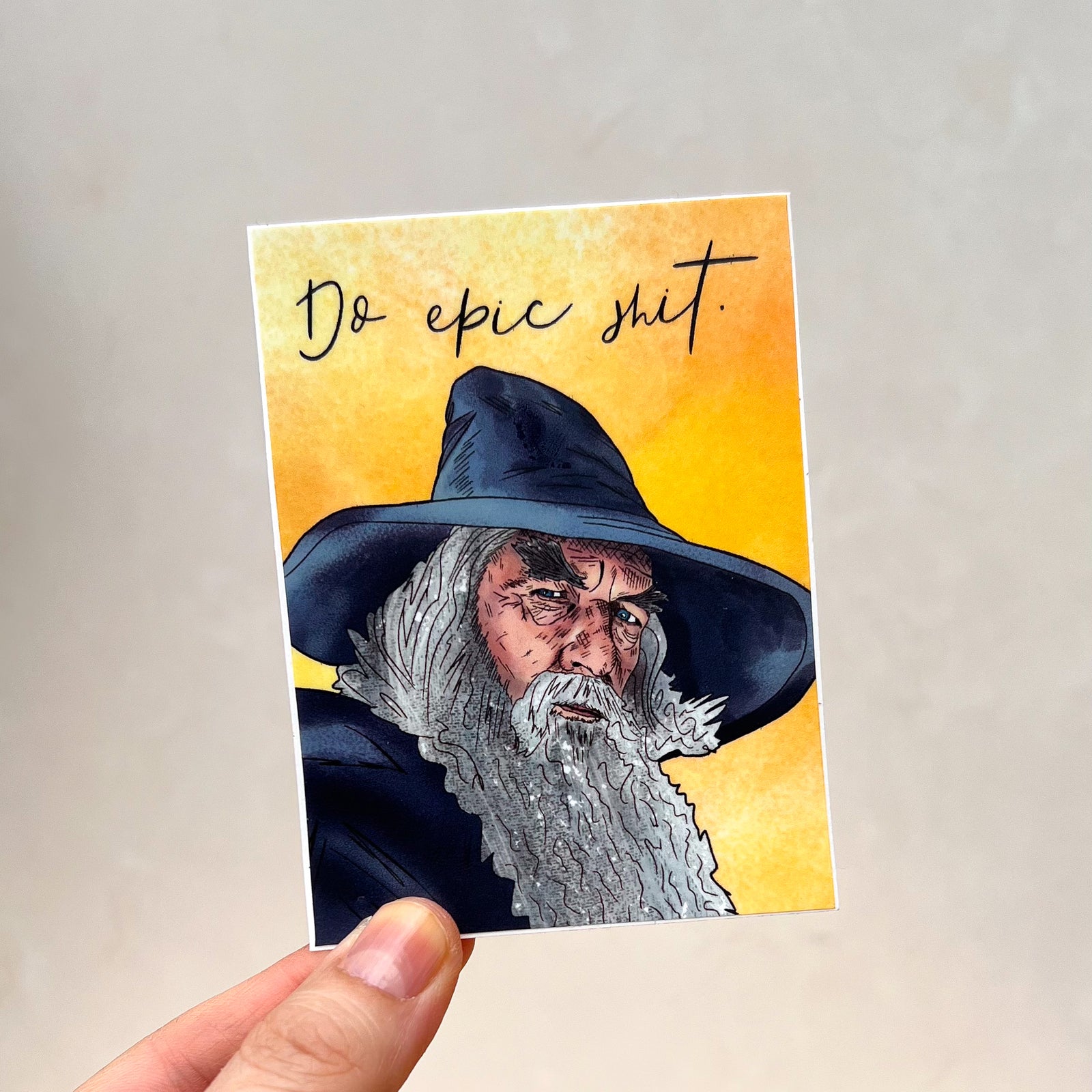 An illustrated sticker featuring Gandalf the Grey and the text "Do epic shit"