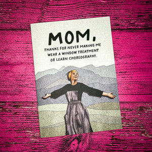 Card with a woman's illustration and humorous text on a pink wooden background