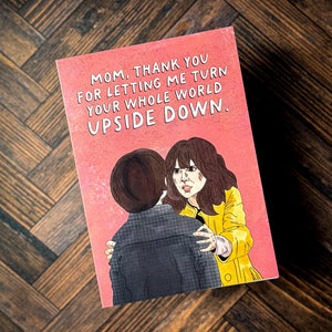 A stranger things mother's day card against a wooden background